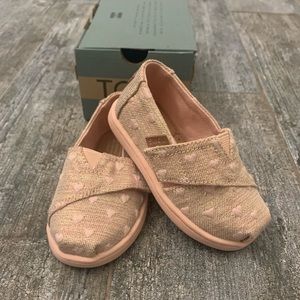 TOMS- new! tiny alpargata shoes. Pink hearts and gold shimmer.